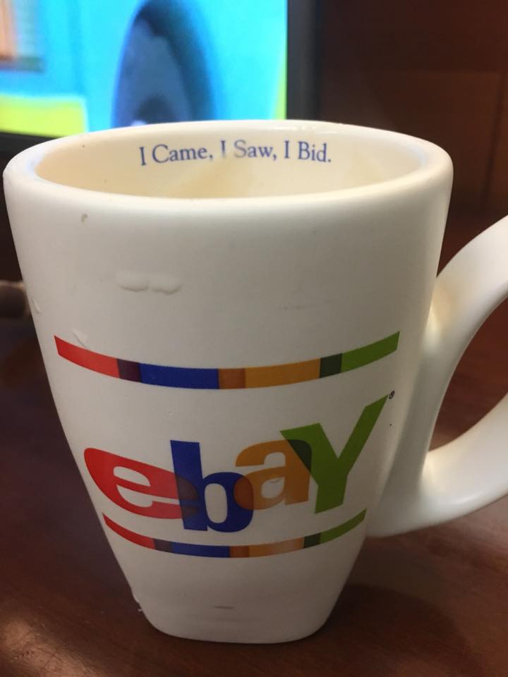 一個印有eBay商標及標語"I Came, I Saw, I Bid"的白色咖啡杯